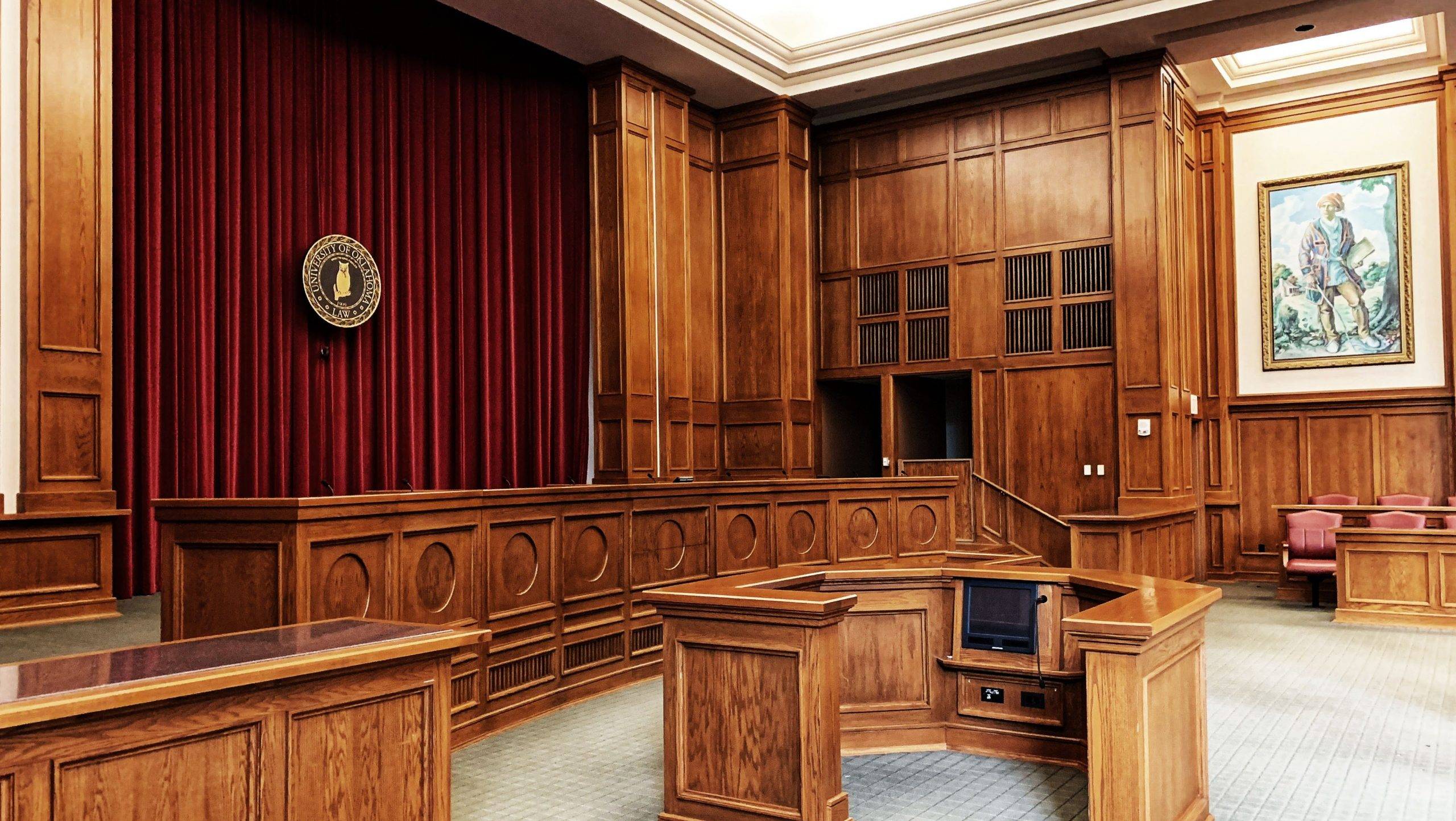 Photo of a courtroom before jurors arrive for jury duty.