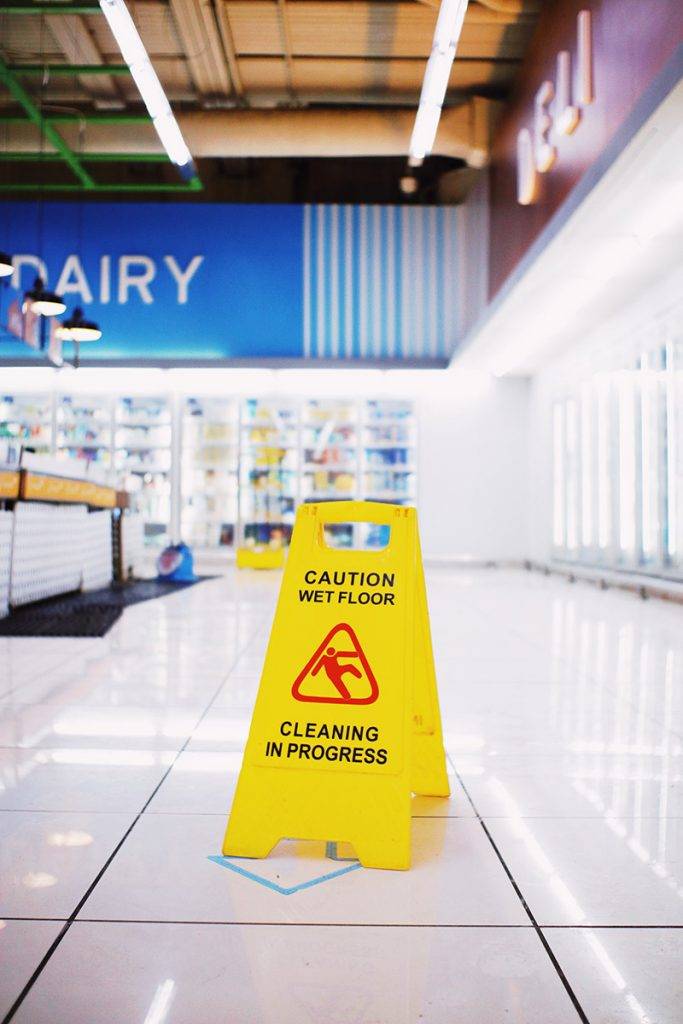 Wet floor sign in a grocery store.